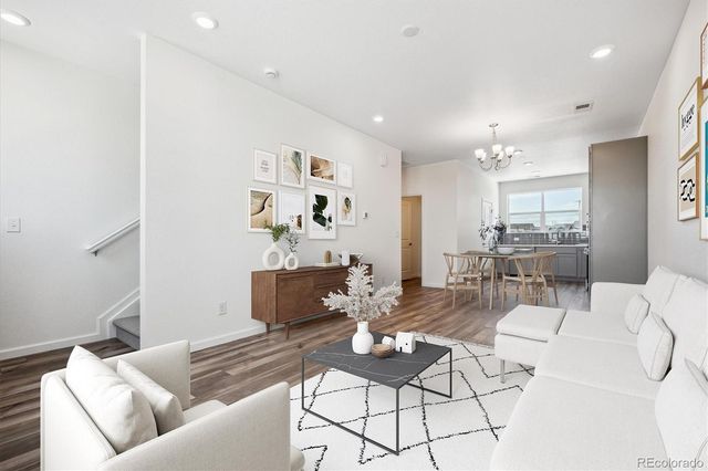 a living room with furniture and a table
