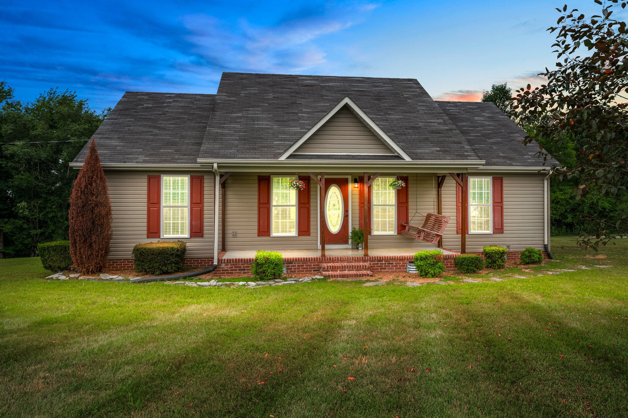 a front view of a house with a yard