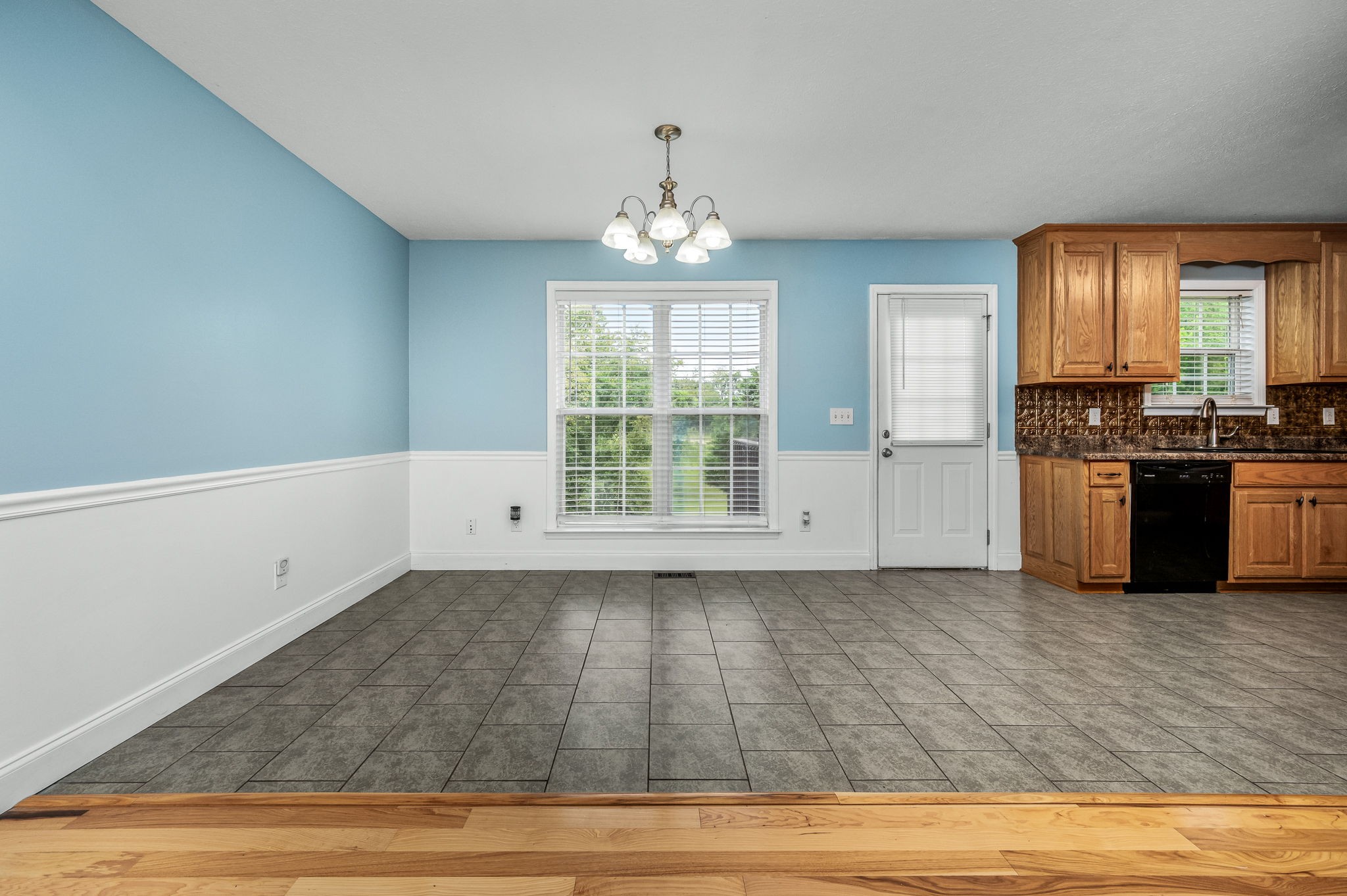 24 Shady Grove Cemetery Road Flintville, TN 37335 - Photo 19 of 40 a view of a kitchen with wooden floor electronic appliances and windows