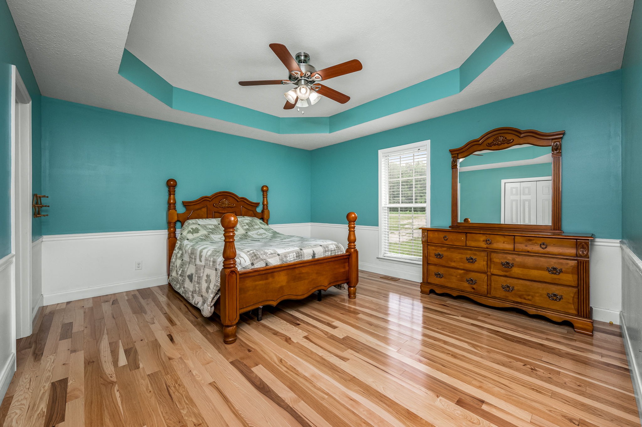 24 Shady Grove Cemetery Road Flintville, TN 37335 - Photo 25 of 40 a bed room with a bed and a chandelier
