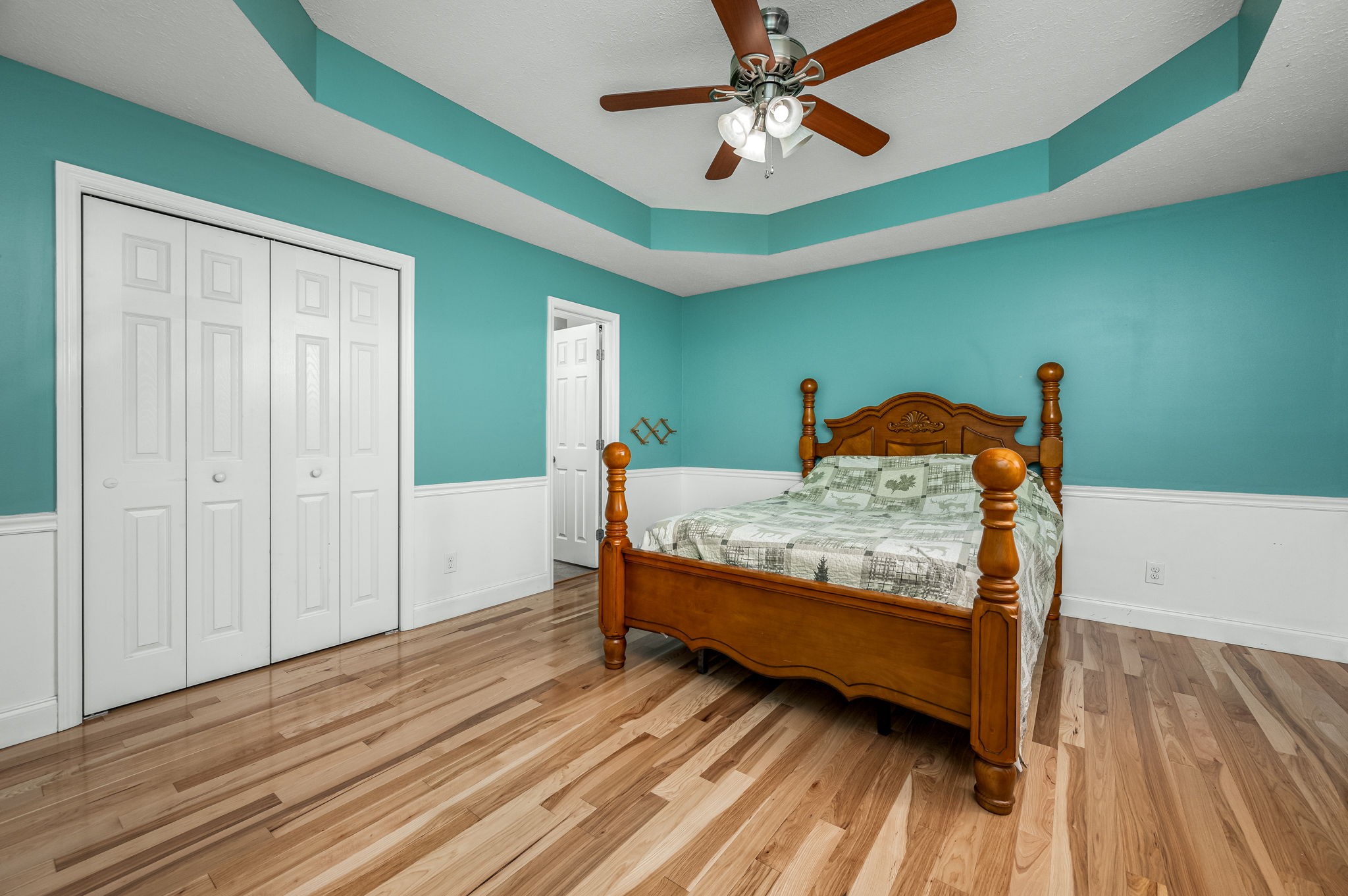 24 Shady Grove Cemetery Road Flintville, TN 37335 - Photo 26 of 40 a bedroom with a bed and a chandelier