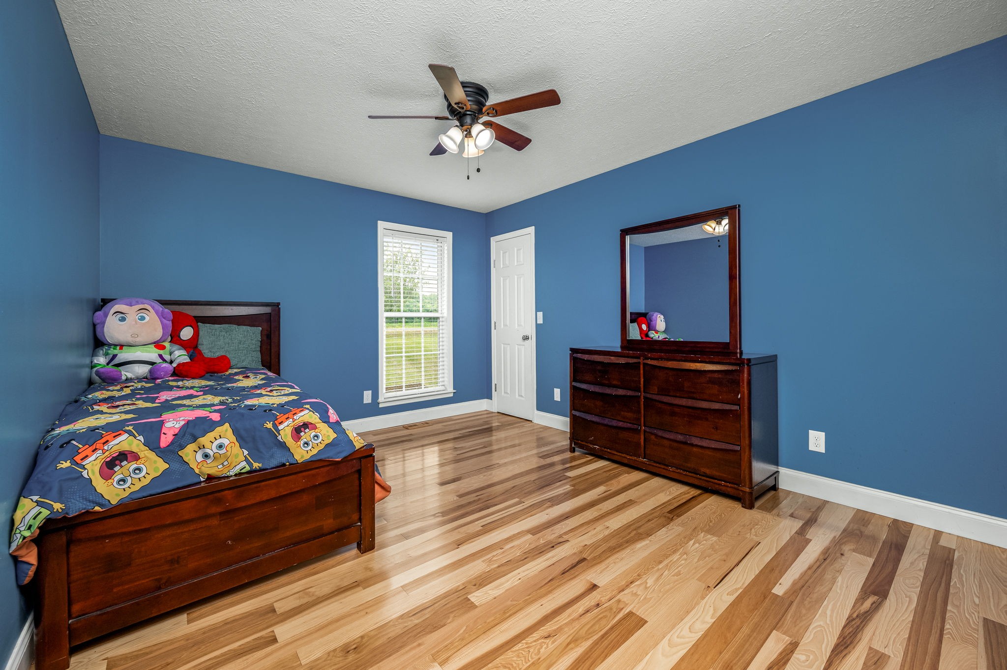 24 Shady Grove Cemetery Road Flintville, TN 37335 - Photo 29 of 40 a bedroom with a bed and a chandelier