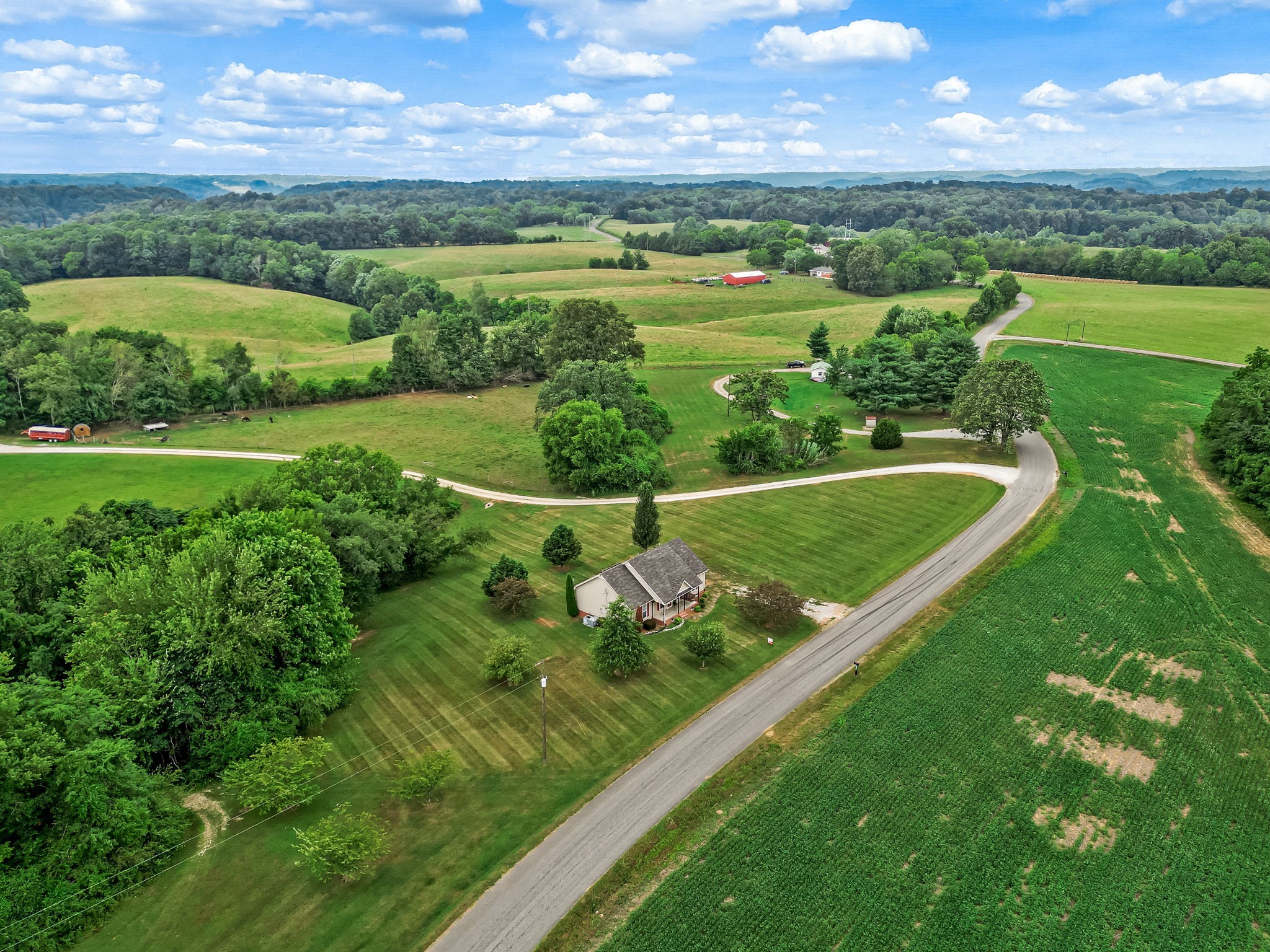 24 Shady Grove Cemetery Road Flintville, TN 37335 - Photo 4 of 40 an aerial view of a golf course with huge green field and large trees