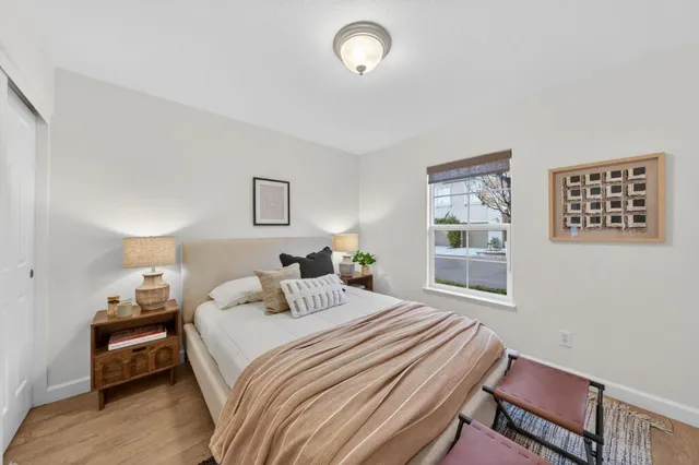 a bedroom with a bed and a window