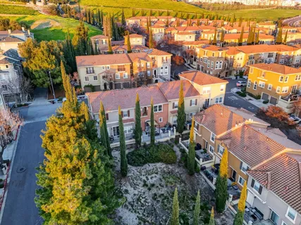 an aerial view of residential houses and outdoor space