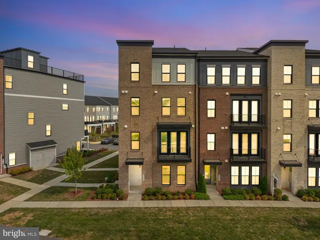 a front view of a building with a swimming pool