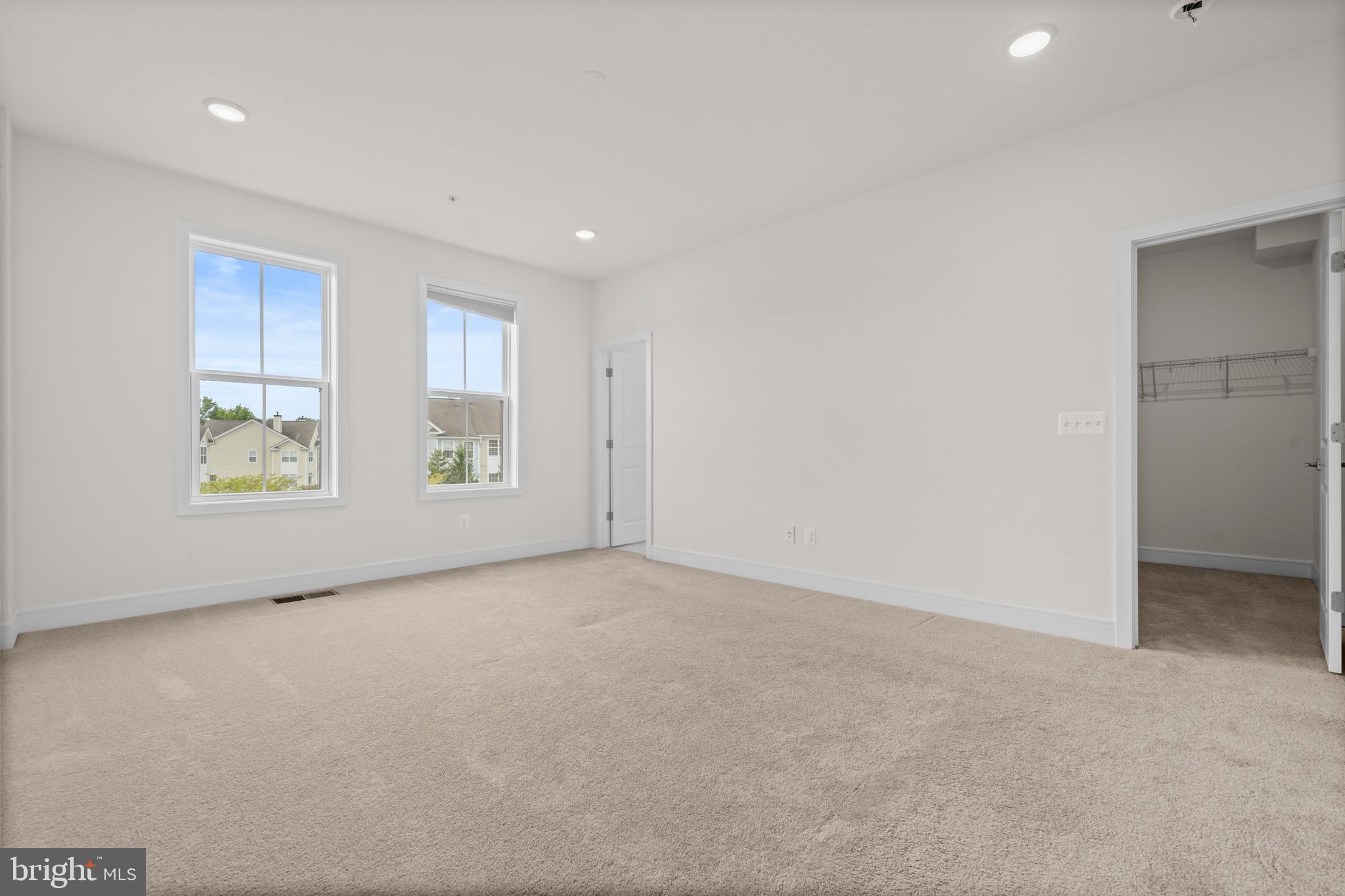 43382 Farringdon Square Broadlands, VA 20148 - Photo 20 of 34 an empty room with windows and closet