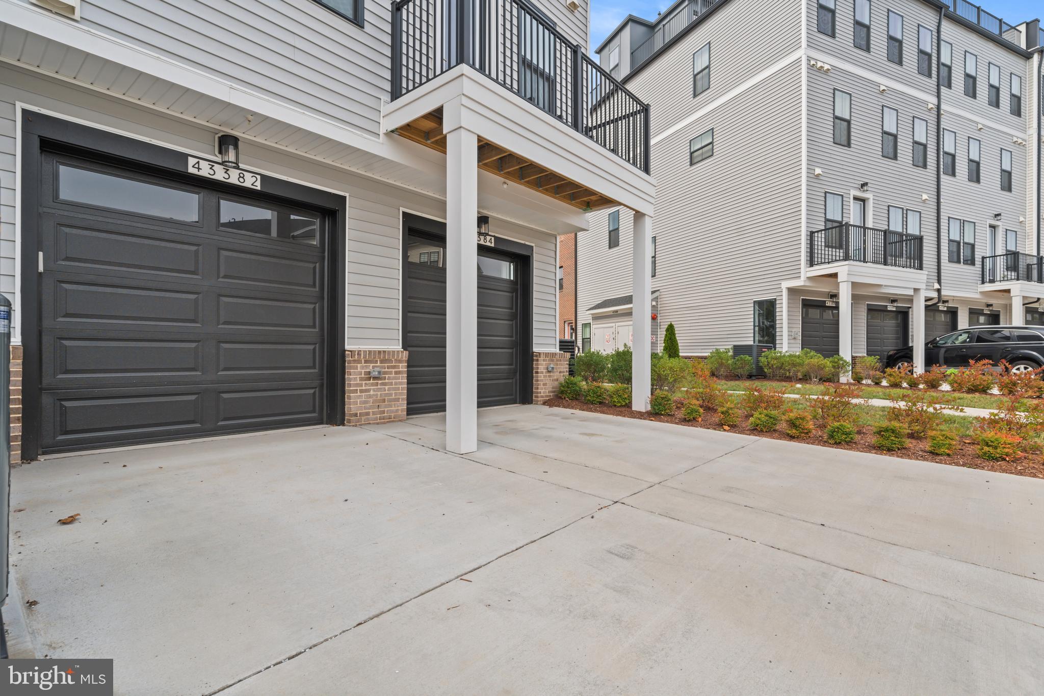 43382 Farringdon Square Broadlands, VA 20148 - Photo 32 of 34 front view of a building with a street