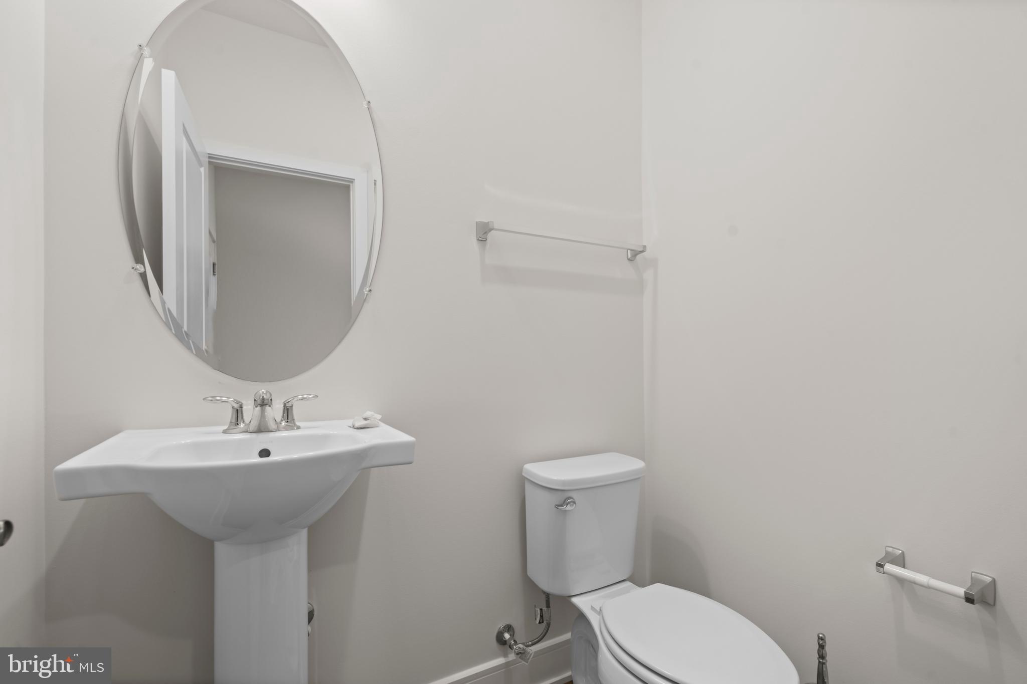 43382 Farringdon Square Broadlands, VA 20148 - Photo 5 of 34 a white toilet sitting next to a bathroom sink