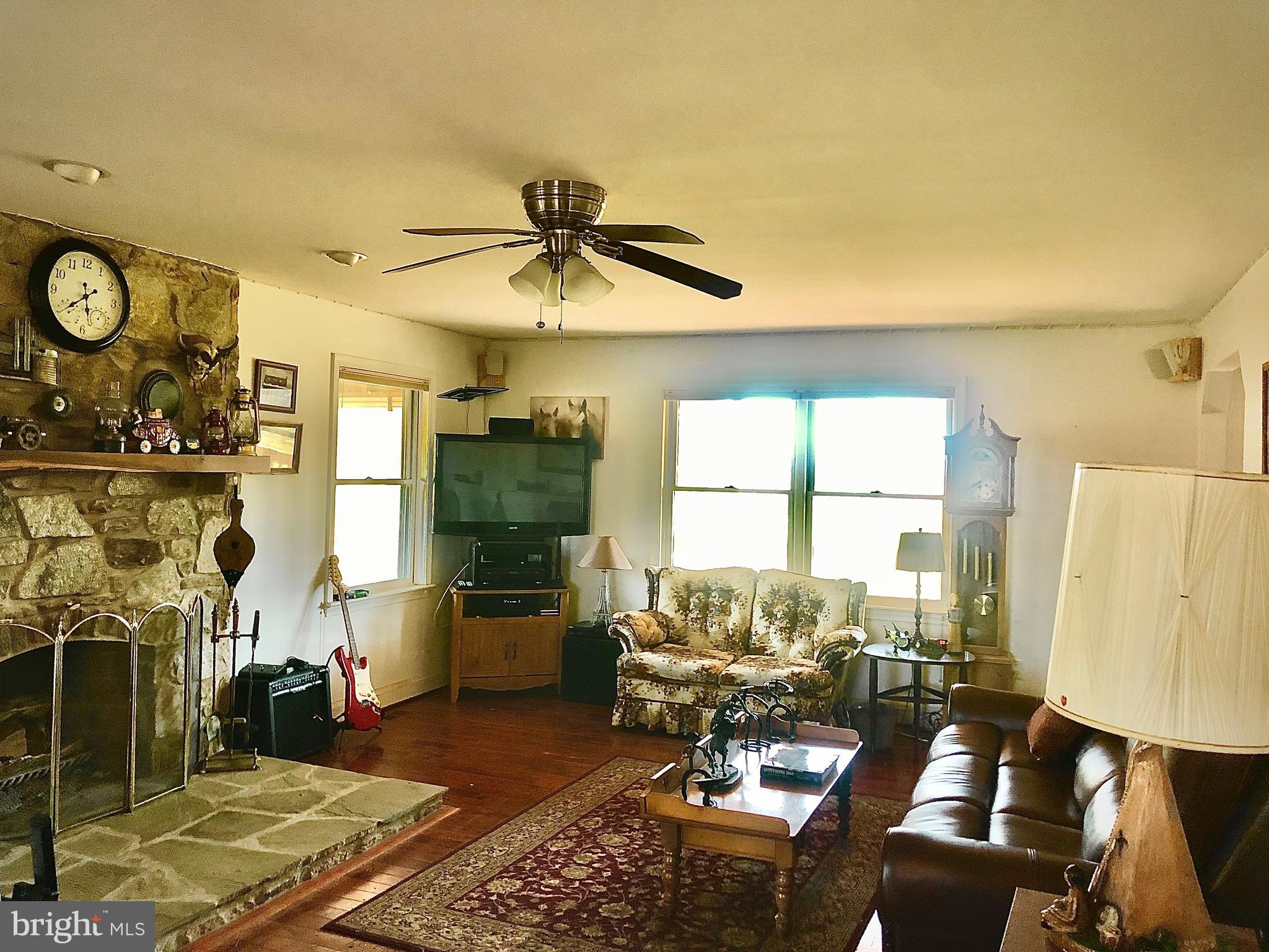 12550 Shoemaker Road Taneytown, MD 21787 - Photo 11 of 30 Living Room with Stone Fireplace