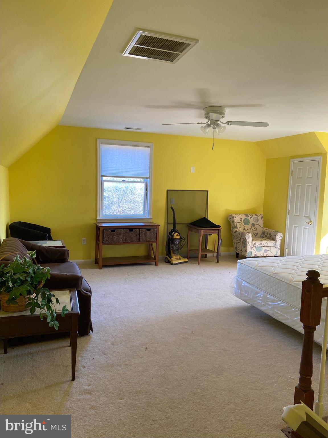 12550 Shoemaker Road Taneytown, MD 21787 - Photo 19 of 30 a living room with furniture and a flat screen tv
