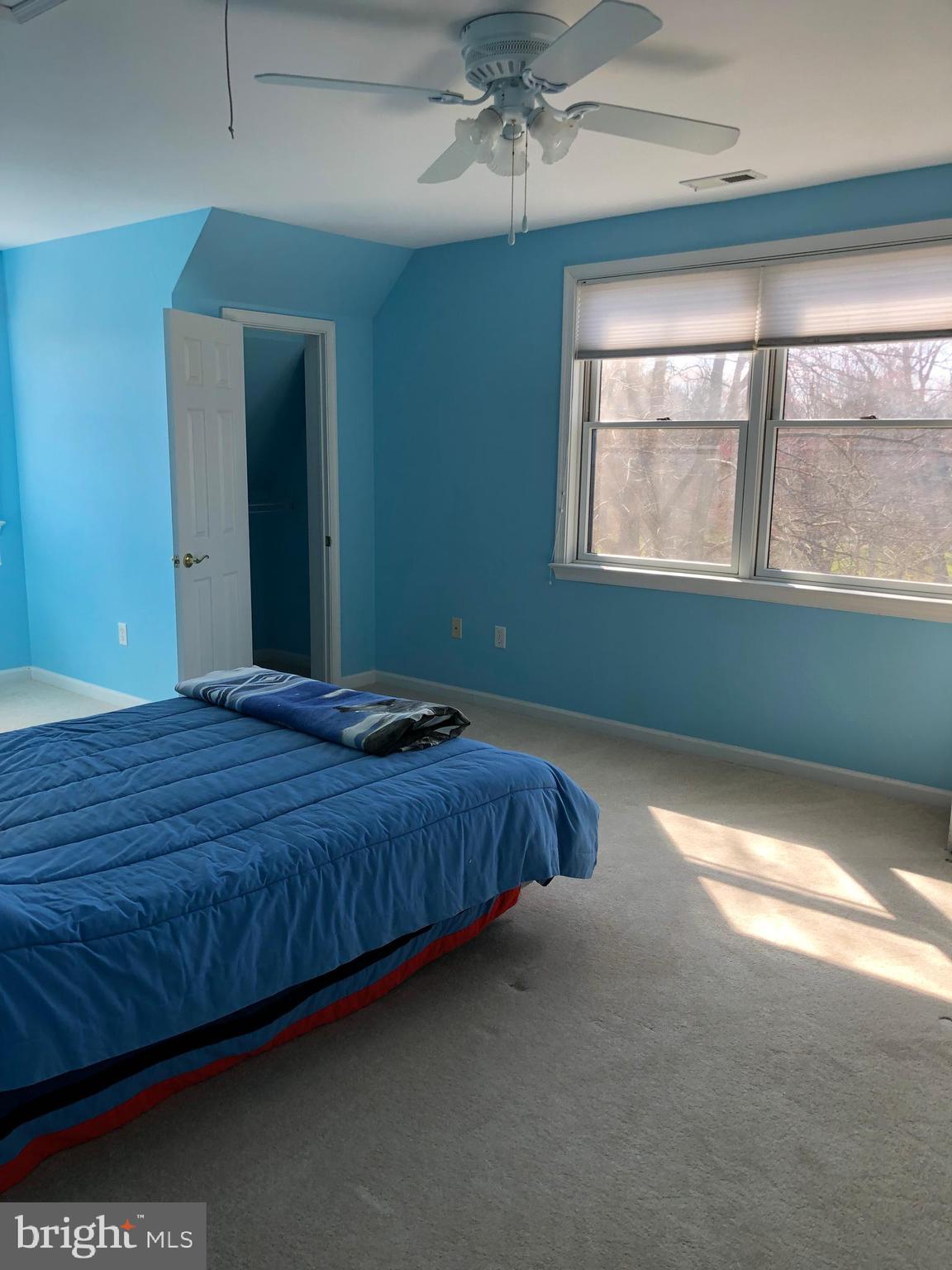 12550 Shoemaker Road Taneytown, MD 21787 - Photo 35 of 53 a bed sitting in a bedroom next to a window