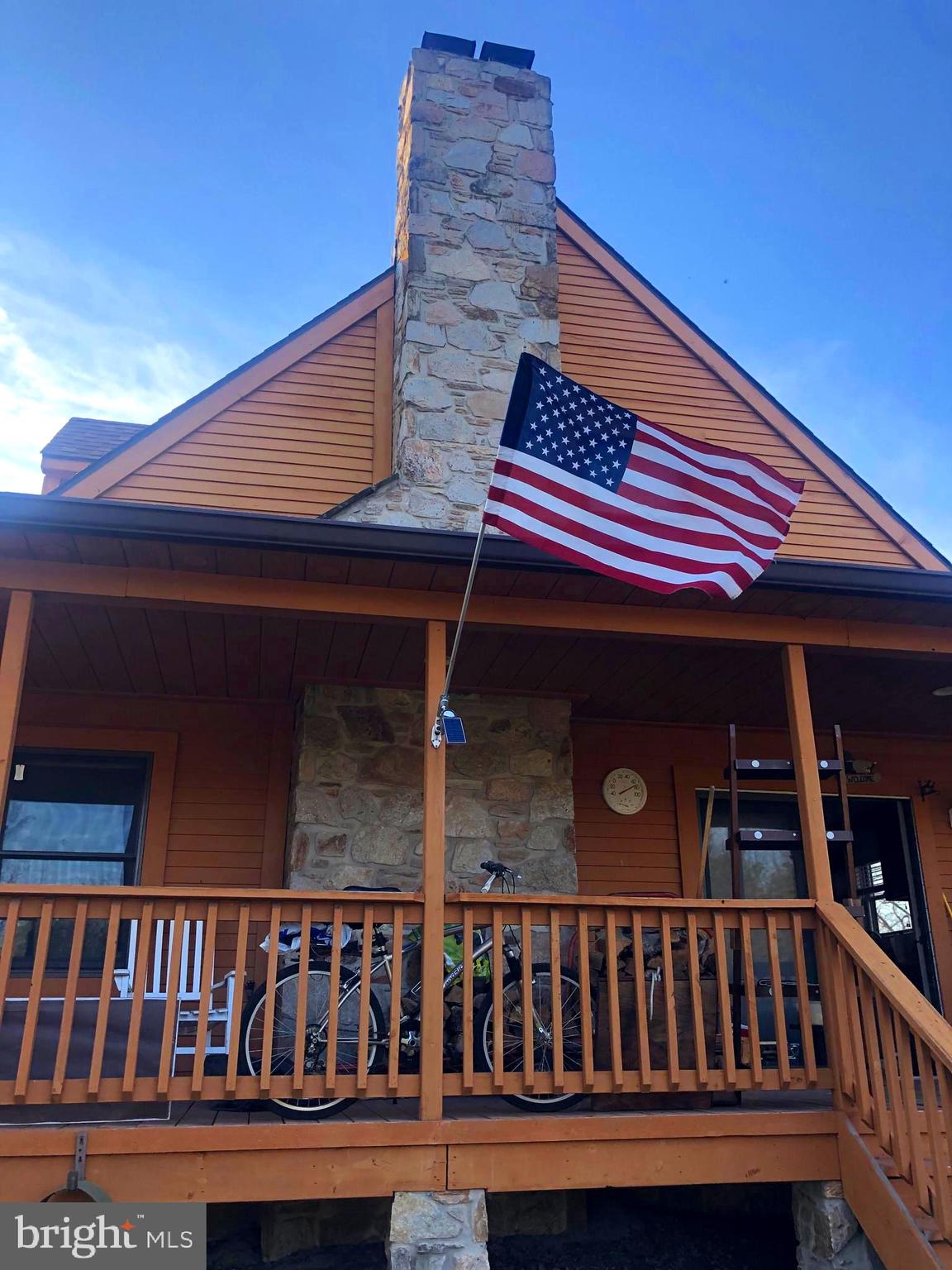 12550 Shoemaker Road Taneytown, MD 21787 - Photo 7 of 30 Side Porch with Stone Fireplace
