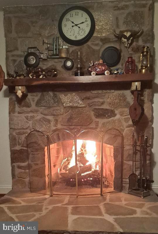 12550 Shoemaker Road Taneytown, MD 21787 - Photo 10 of 53 a view of a fireplace with two chairs in it