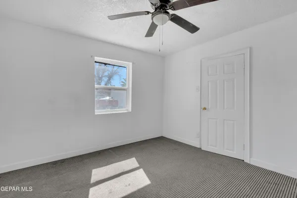 a utility room with cabinets washer and dryer