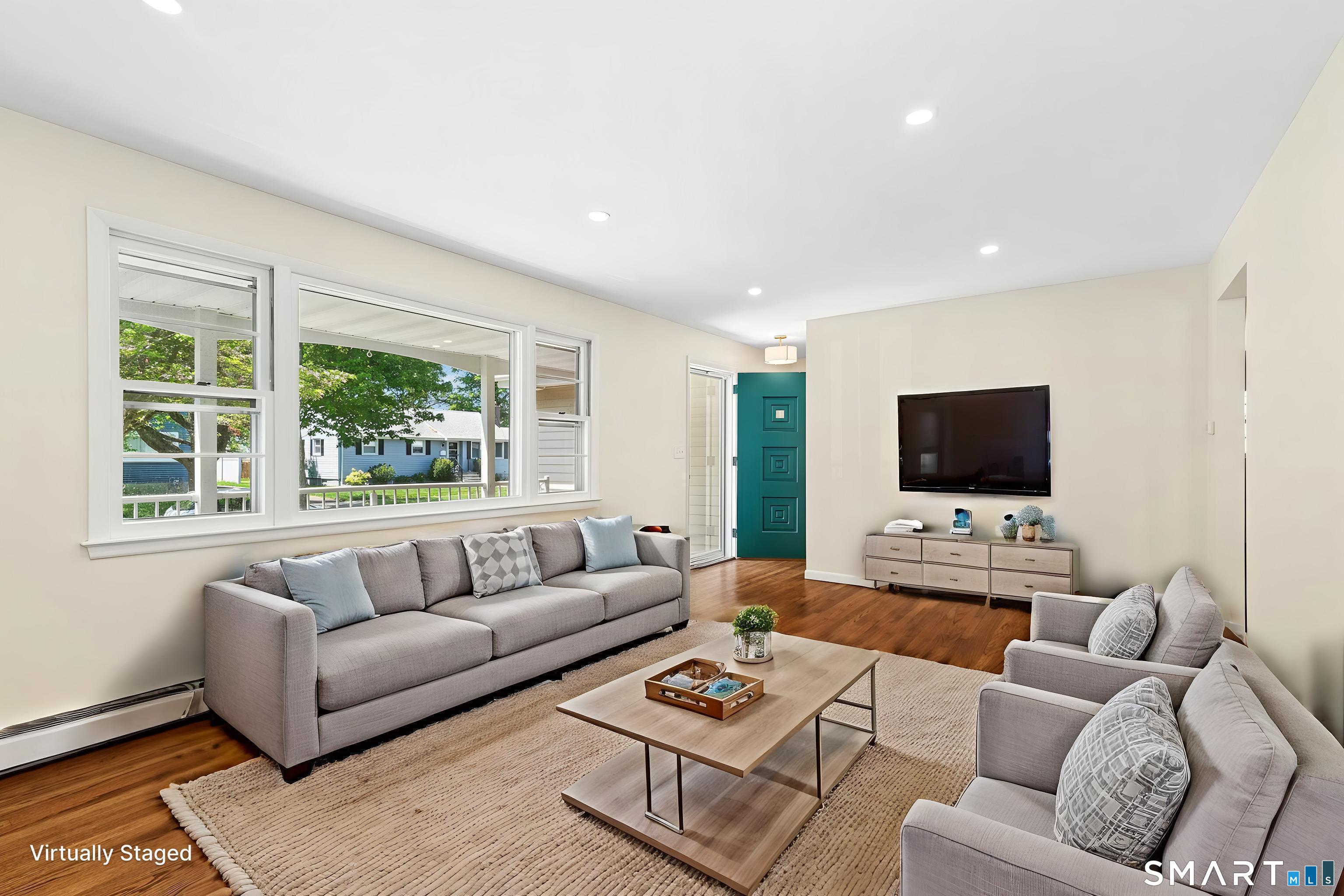 140 Spring Street Stratford, CT 06614 - Photo 7 of 29 a living room with furniture and a flat screen tv