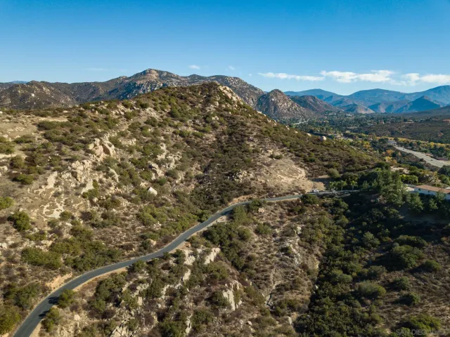 a view of a mountain range with mountains in the background