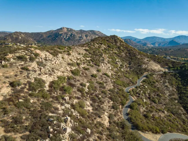 a view of a mountain range in a cloudy sky