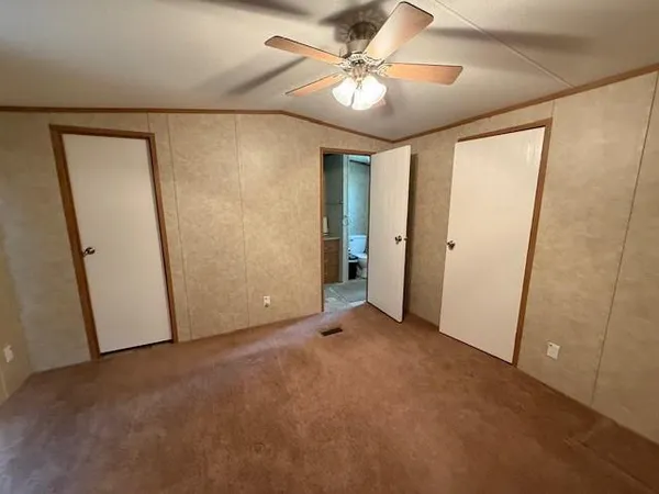 a bathroom with a sink a toilet a mirror and shower