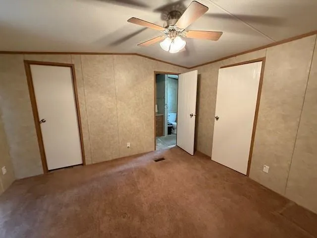 a bathroom with a sink a toilet a mirror and shower