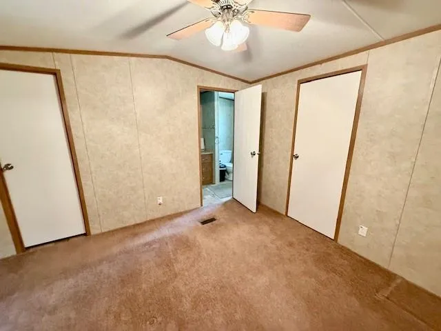 a bedroom with a bed and a shower