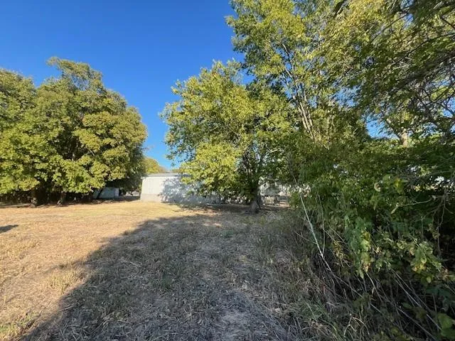 a view of a backyard of a house