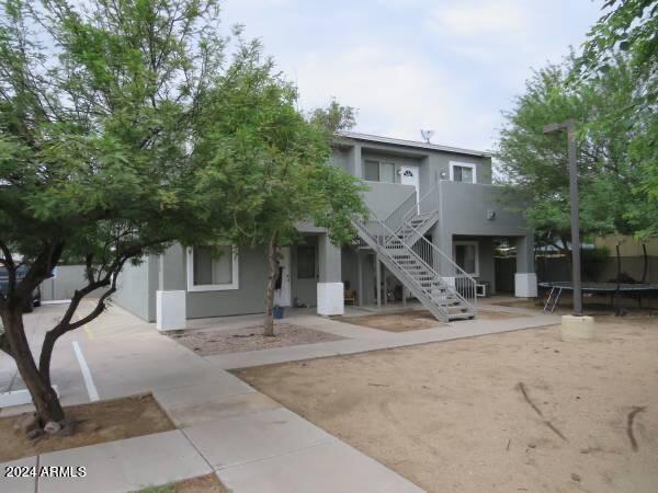1614 West Purdue Avenue, Unit 102 Phoenix, AZ 85021 - Photo 11 of 11 a house view with a backyard space
