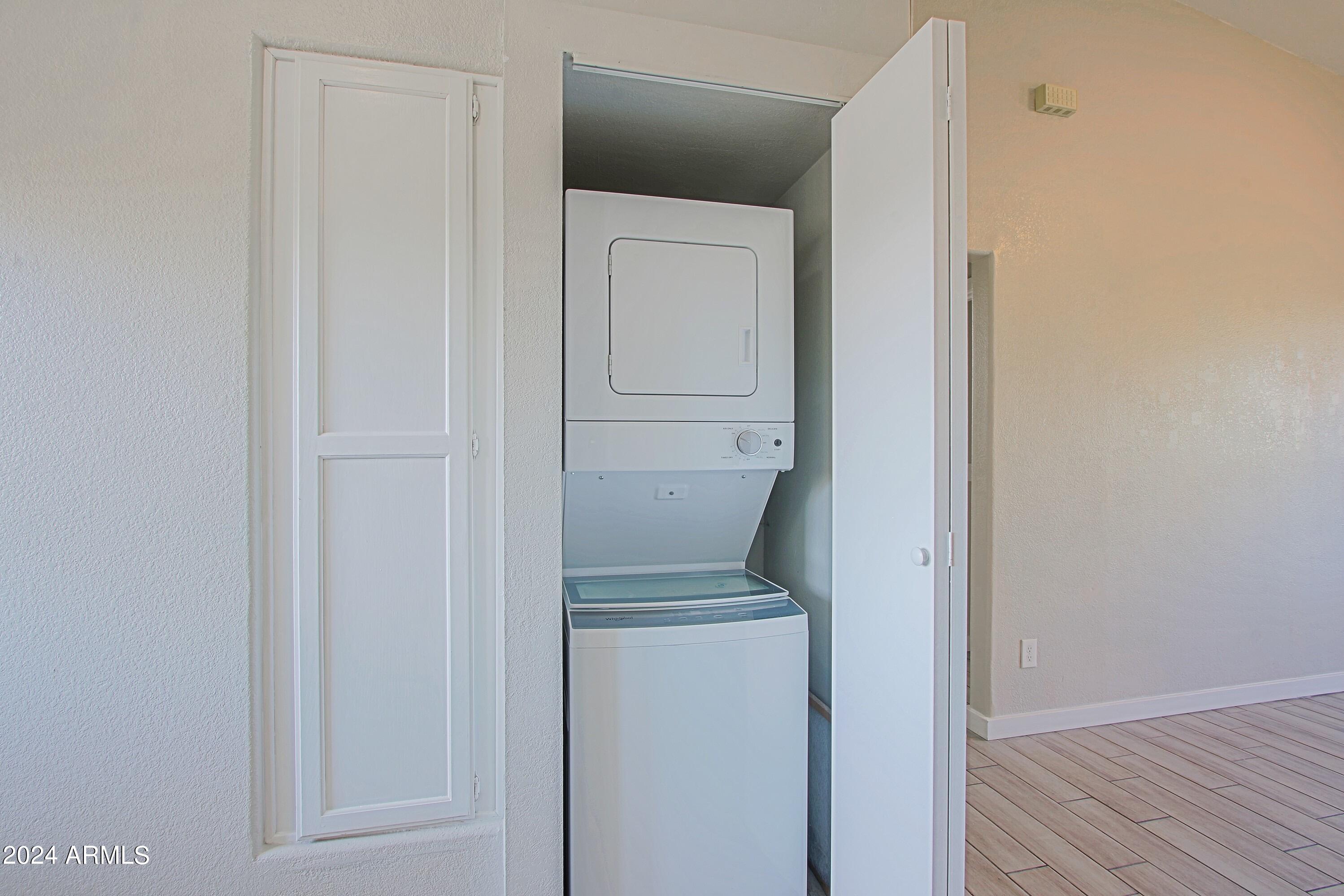 1614 West Purdue Avenue, Unit 102 Phoenix, AZ 85021 - Photo 9 of 11 a view of washer and dryer