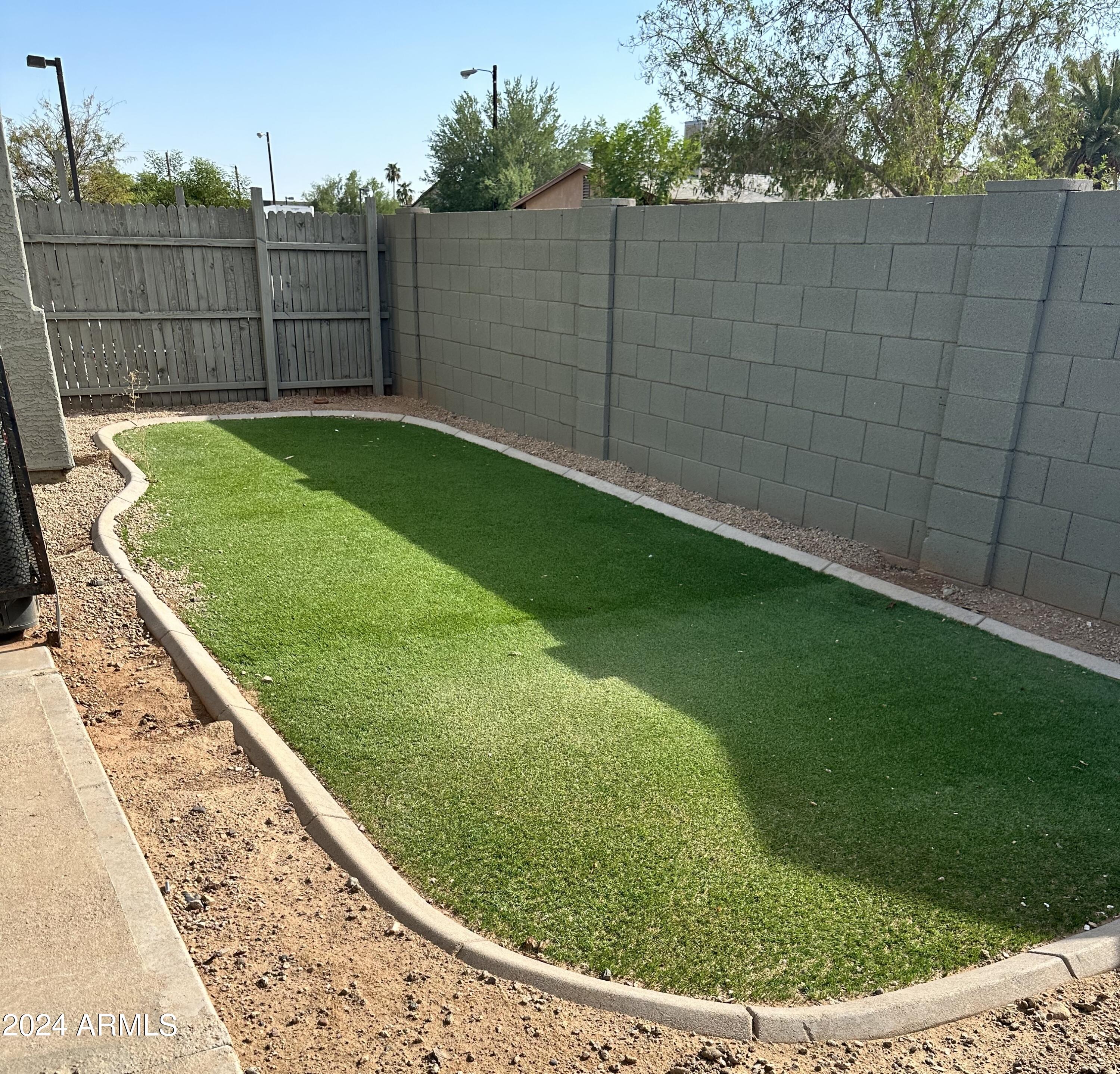 1614 West Purdue Avenue, Unit 102 Phoenix, AZ 85021 - Photo 10 of 11 a view of a backyard with a cabin