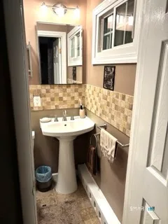 a bathroom with a sink and a mirror