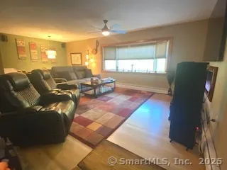 a living room with furniture window and a table