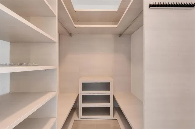 a view of an empty walk in closet