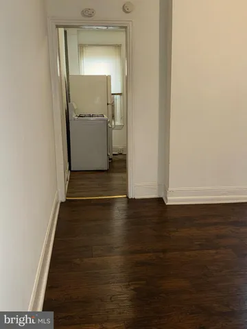 a view of a livingroom with wooden floor