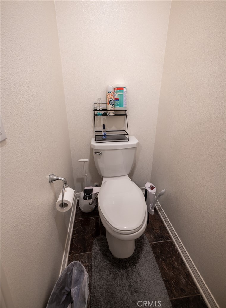1099 Little Leaf Street Calimesa, CA 92320 - Photo 21 of 32 a bathroom with a toilet