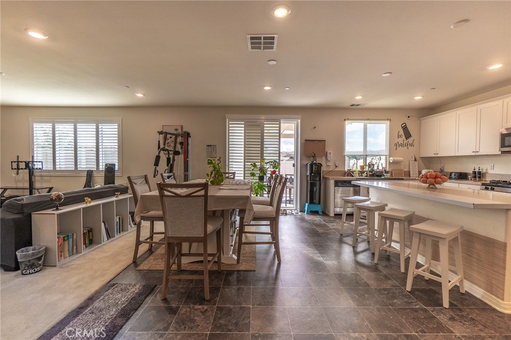 1099 Little Leaf Street Calimesa, CA 92320 - Photo 9 of 32 a view of a dining area with furniture