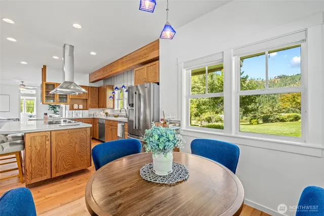 a view of a dining room with furniture window and wooden floor