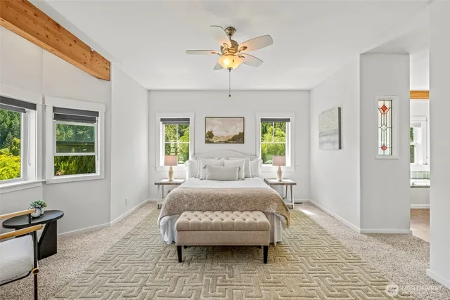 a bedroom with a bed and window