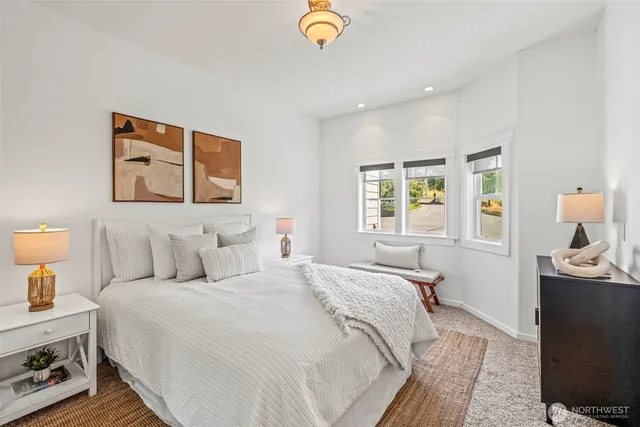 a bedroom with bed and window