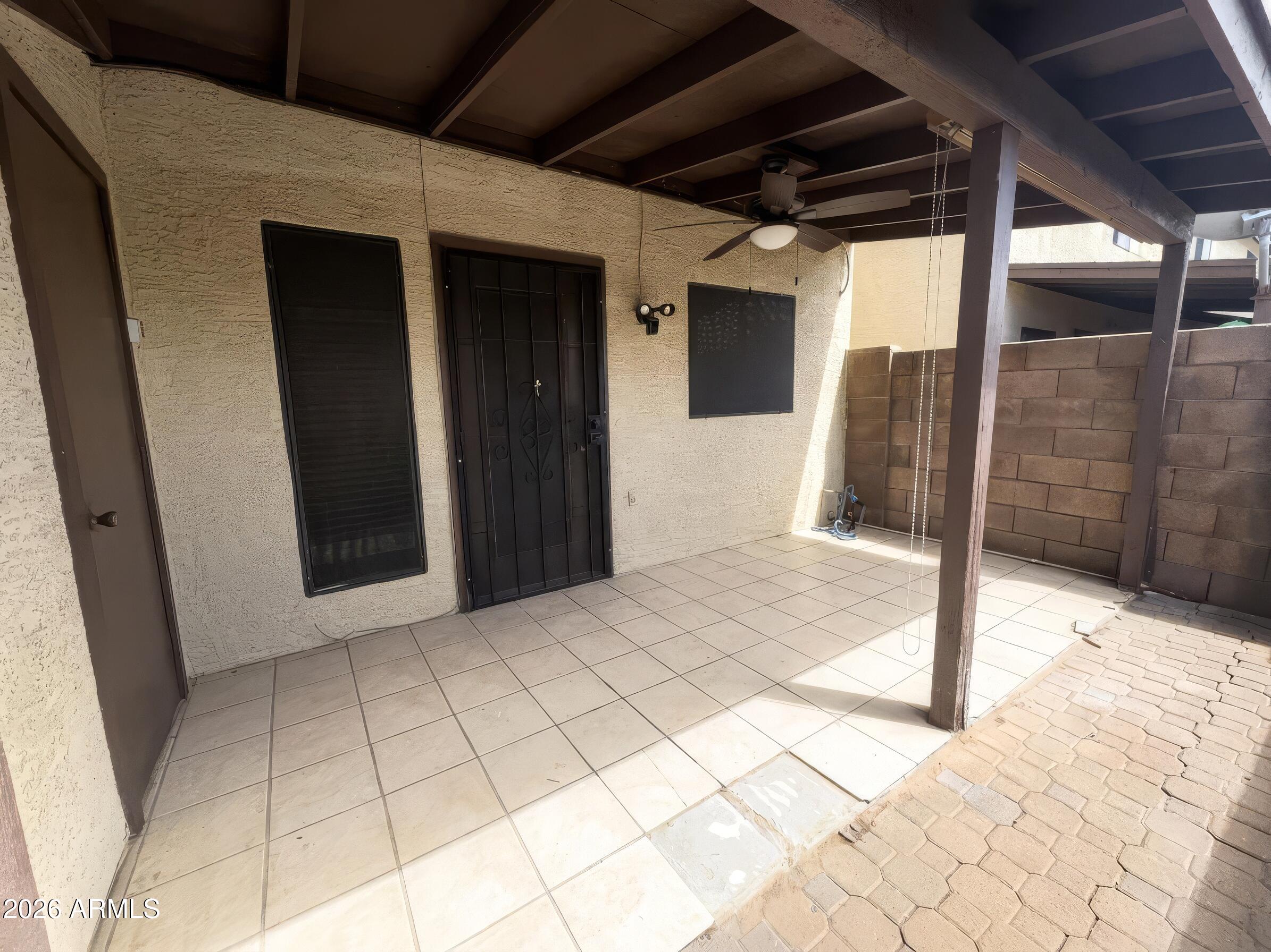 170 East Guadalupe Road, Unit 142 Gilbert, AZ 85234 - Photo 28 of 32 28 - Back covered patio with storage clo