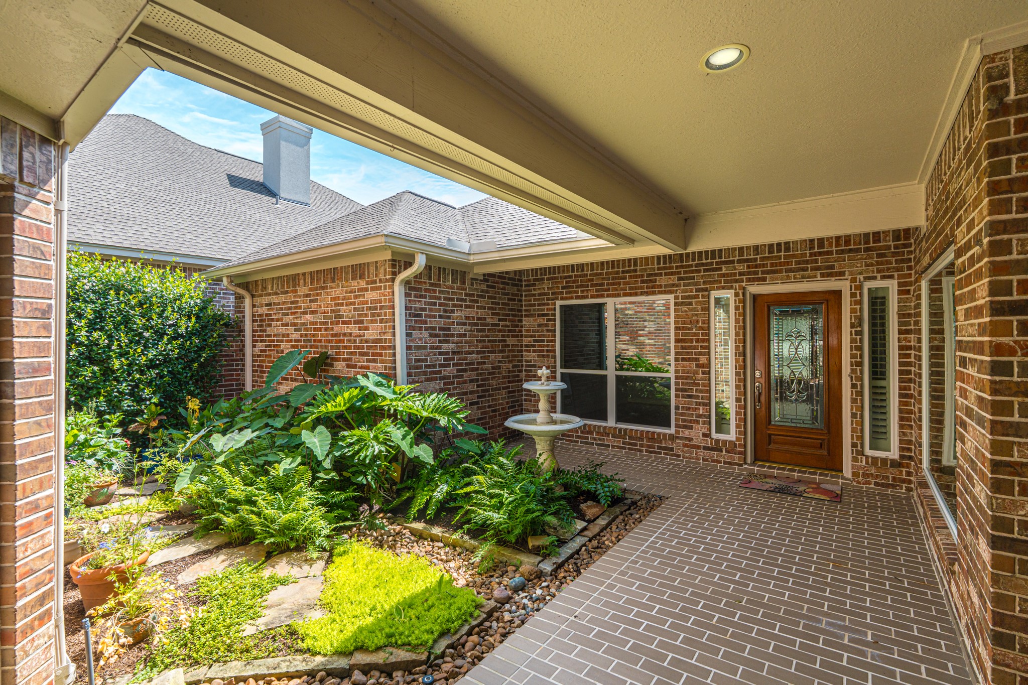 20714 Flora View Court Spring, TX 77379 - Photo 5 of 40 a front view of a house with garden