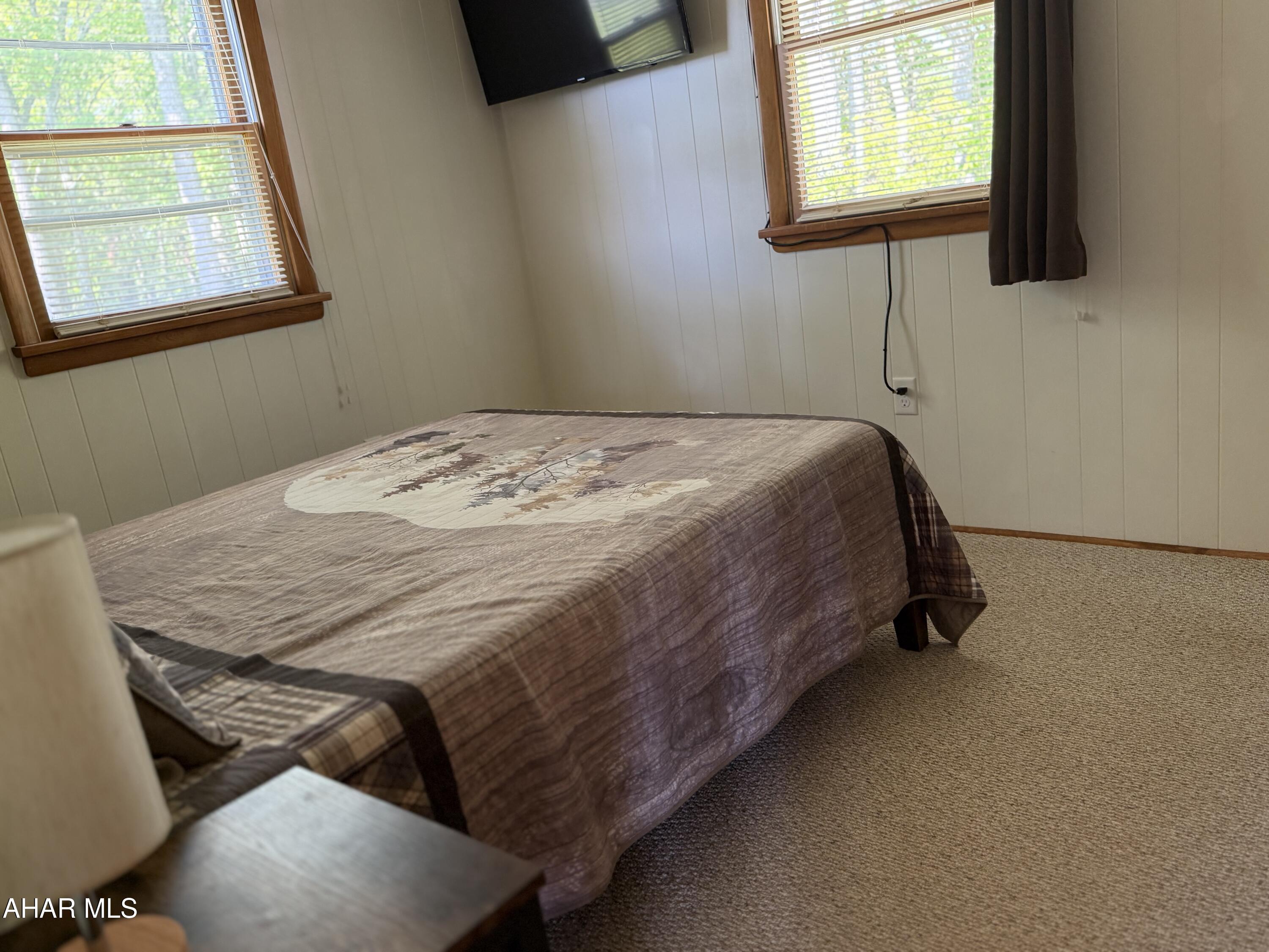 473 Calhoun Road Everett, PA 15537 - Photo 23 of 45 a bed sitting in a bedroom next to a window