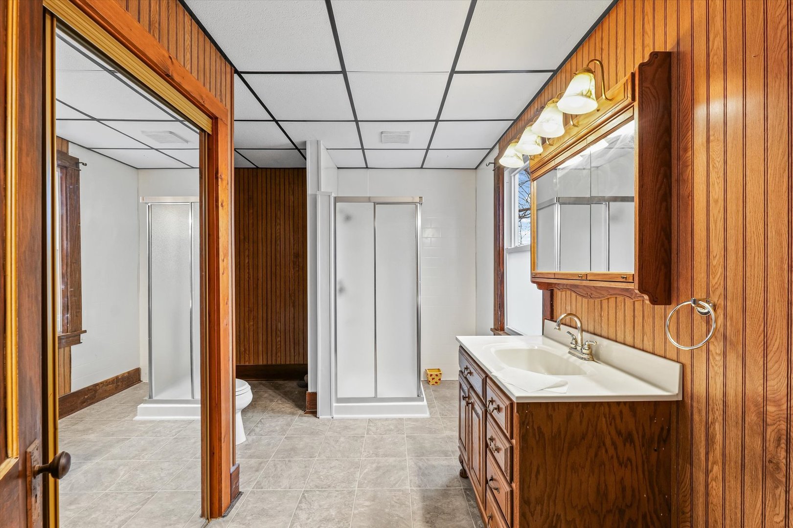 113 Columbus Street Sibley, IL 61773 - Photo 19 of 39 a bathroom with a granite countertop sink and a mirror