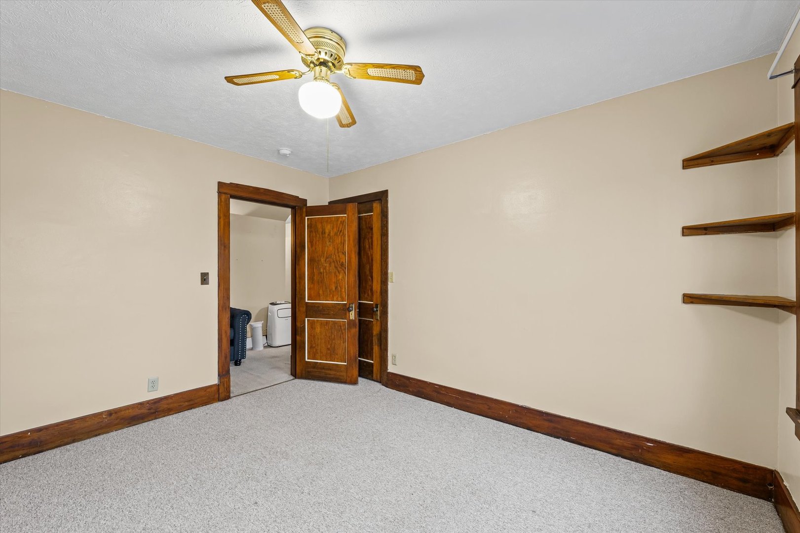 113 Columbus Street Sibley, IL 61773 - Photo 27 of 39 an empty room with closet and chandelier fan