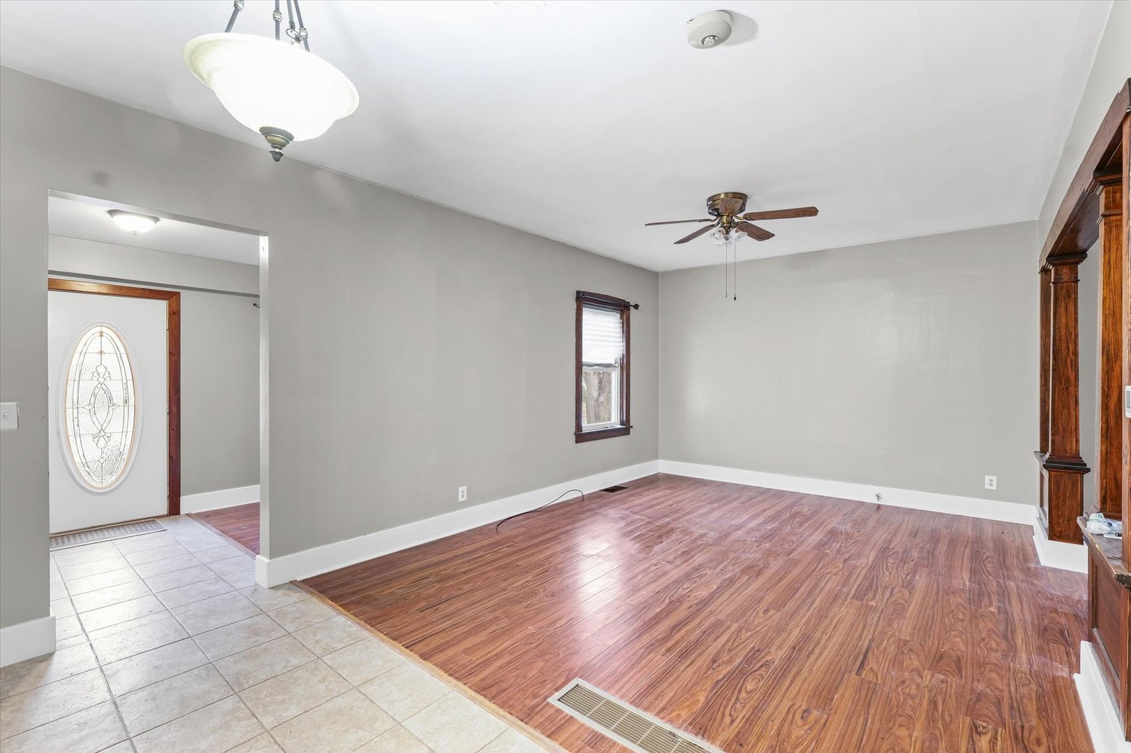 113 Columbus Street Sibley, IL 61773 - Photo 6 of 39 a view of a room with wooden floor and a ceiling fan