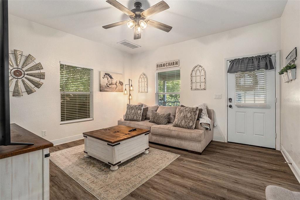 4921 6th Street Zephyrhills, FL 33542 - Photo 2 of 15 a living room with furniture and a window