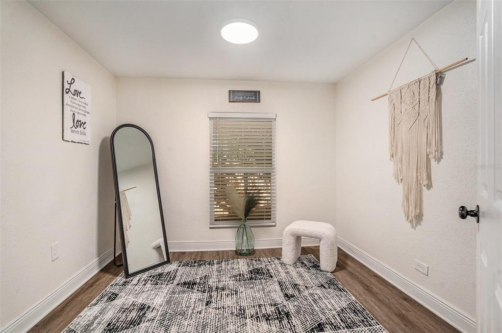 4921 6th Street Zephyrhills, FL 33542 - Photo 9 of 15 a bedroom with a bed and a window