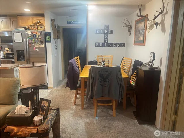 a kitchen with sink refrigerator and window