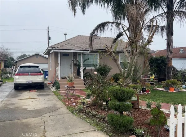 a house view with a garden space