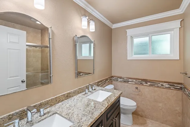a bathroom with a shower and a sink