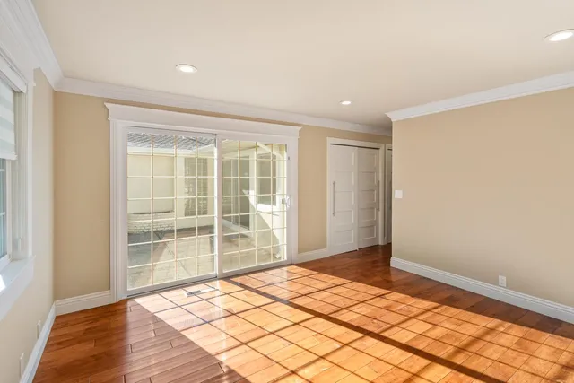 a view of a garage with rack and bicycle